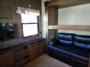Alternative view of room with couch and bed inside 2015 Heartland Gateway