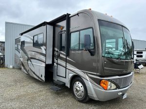 2008 Fleetwood Pace Arrow front exterior view, showing slideout and door