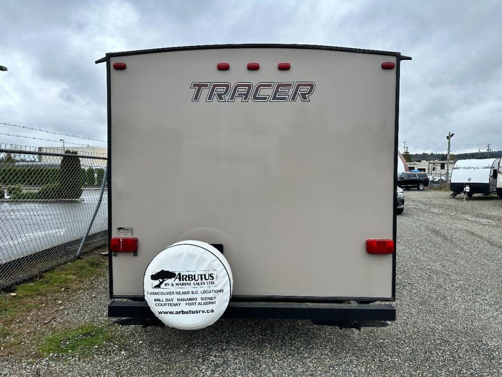 Exterior back view of 2015 Forest River Tracer showing spare tire.