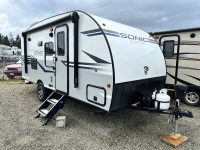Exterior of Sonic Lite RV showing exterior door and hitch.