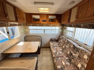 Dining area with a long couch.